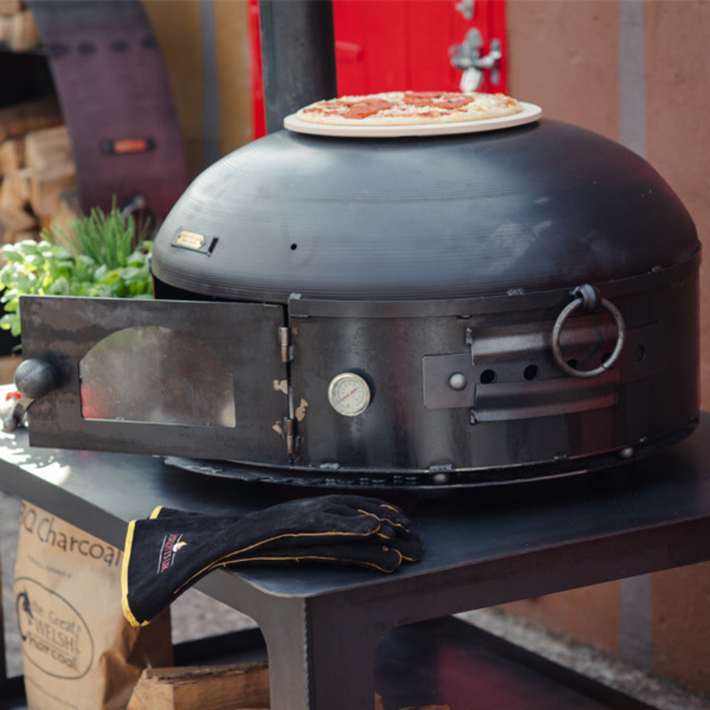 Firepits UK Dome Oven on table with pizza on top