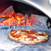 Igneus Pro 750 Wood-Fired Pizza Oven cooking pepperoni pizza