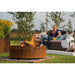 GrillSymbol Corten Steel Fire Pit Legend, ø 116 cm fire lit with family