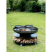 Ring of Logs 120 with Four Swing Arm BBQ Racks Firepits UK in garden