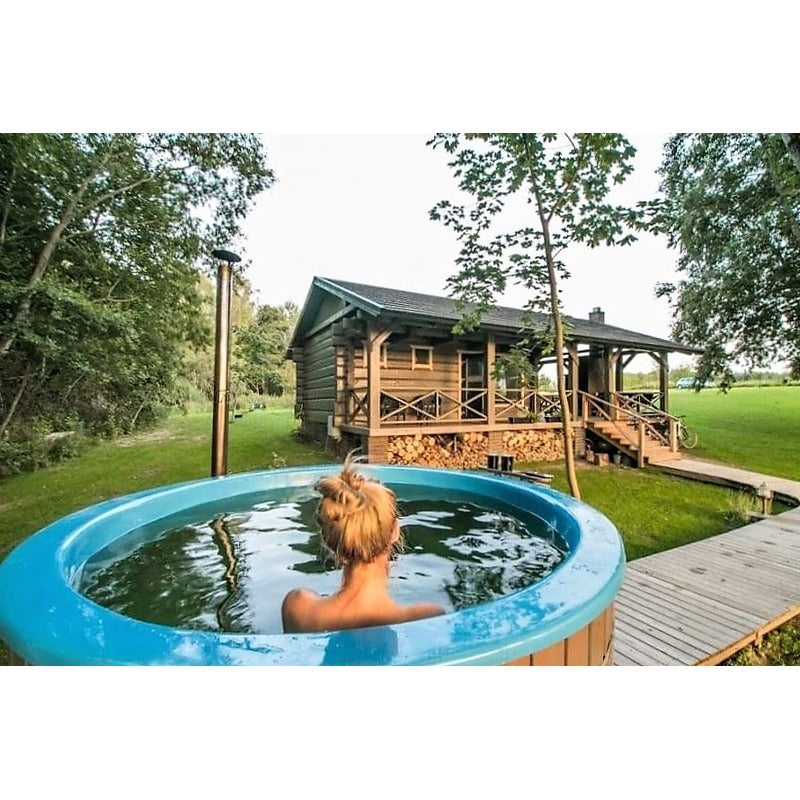 woman in hot tub with house view